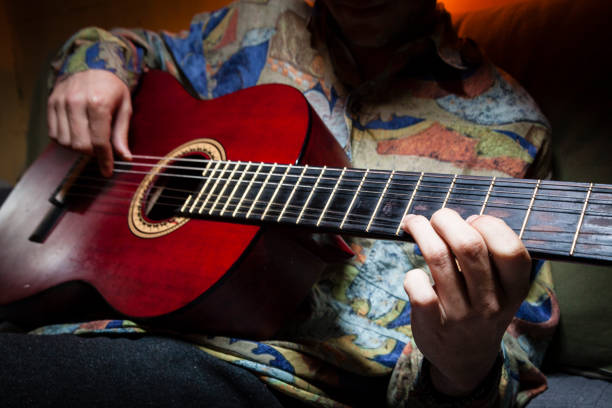 Man playing acoustic guitar.