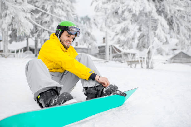 istock Man wearing a snowboard outdoors 912252044