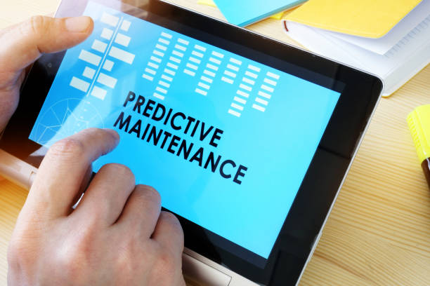 istock Man holding tablet with title Predictive Maintenance. 912254386