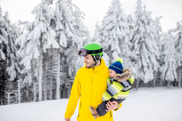 istock Man snowboarding at the mountains 912255766