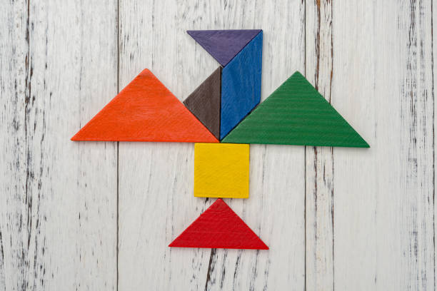 istock wooden tangram shaped like a flying bird 912256146