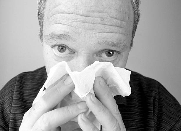 Man blowing his nose #3 stock photo