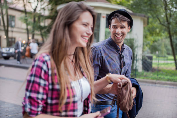 istock Young couple walking in a city 912256272