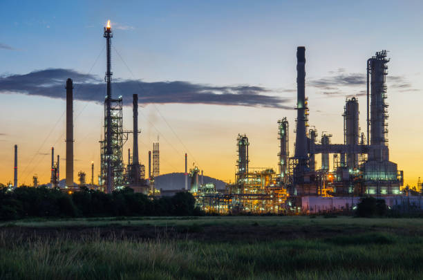 istock Oil refinery Thung grass with morning light 912259500
