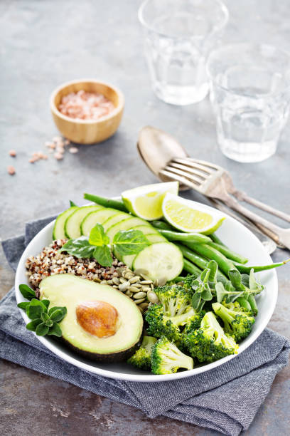 istock Green vegan lunch bowl with quinoa and avocado 912263076