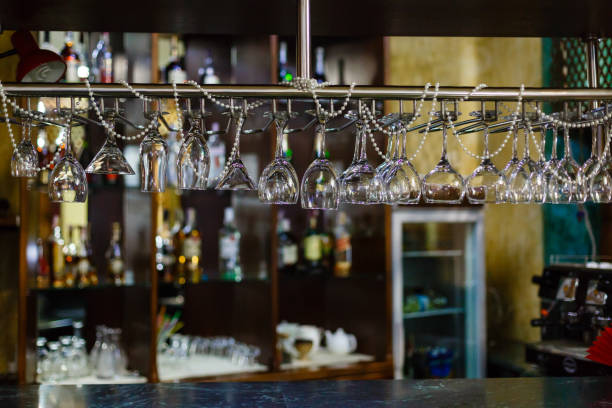 istock Empty glasses for alcohol beverage above a bar rack background 912268148