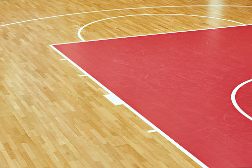 Basketball court parquet in indoors sport gym