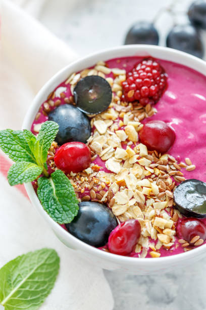 istock Red smoothie bowl with beets and black grapes. 912277128