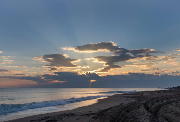 istock Romantic sunset, clouds, waves and the sea in Lara beach, Antalya, Turkey. 912277182