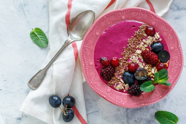 istock Red smoothie bowl with beets, blackberries and brown flax. 912277262