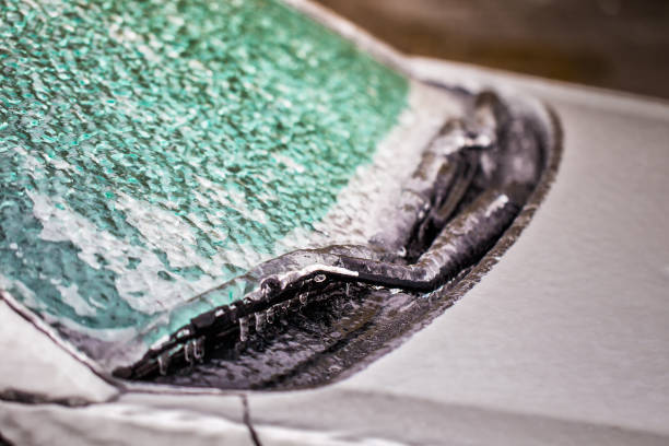 fragment of car covered with ice car wipers covered with ice after icy rain, selective focus windshield wiper snow stock pictures, royalty-free photos & images