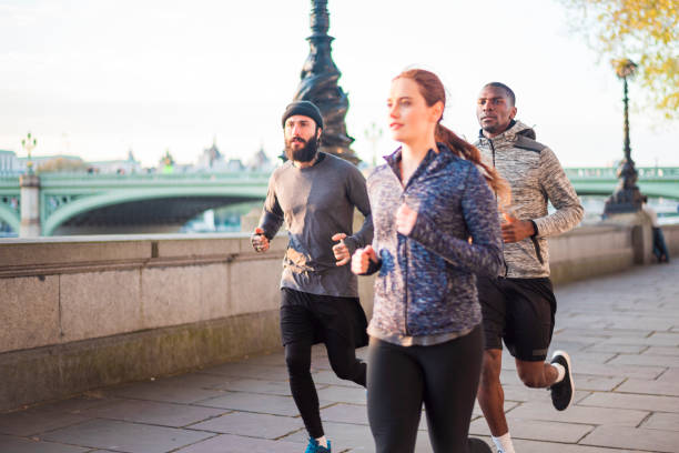 Friends jogging on promenade