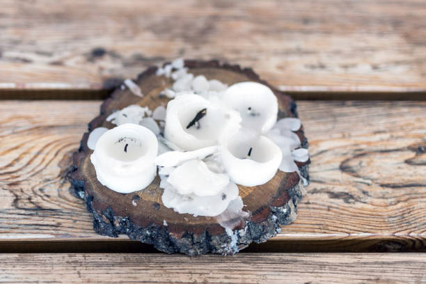 istock Burnt candles with melted wax on a wooden table 912282204