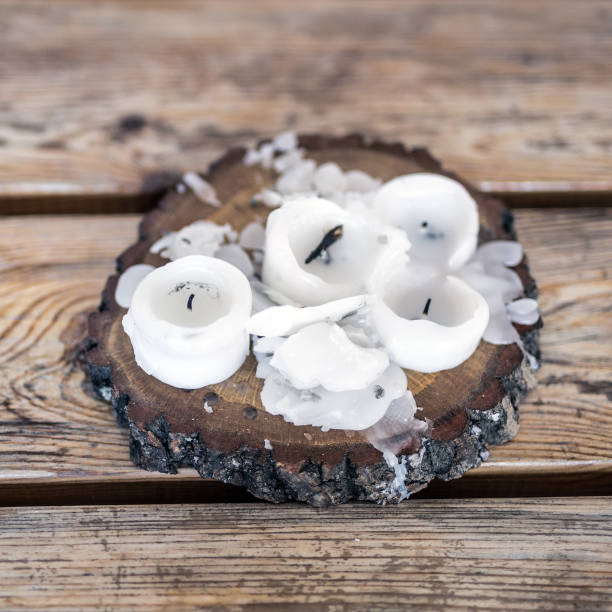 istock Burnt candles with melted wax on a wooden table 912282214