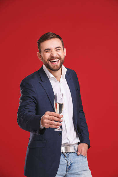 istock Portrait of man having fun with sparkling wine. Celebration concept 912282514