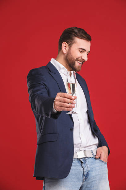 istock Portrait of man having fun with sparkling wine. Celebration concept 912282556