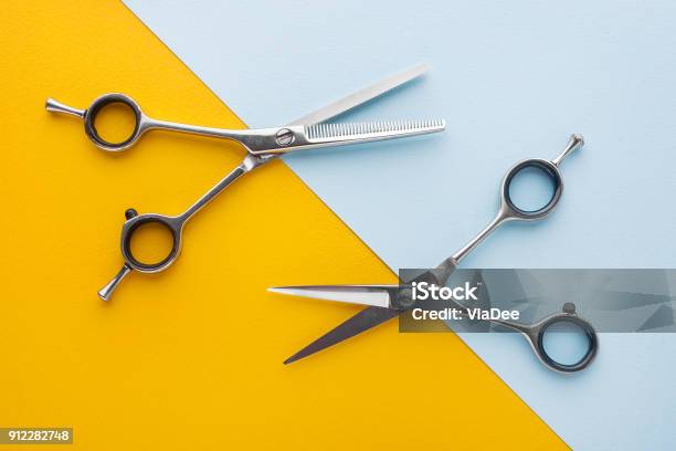 Two Sets Of Stainless Steel Hairdressing Scissors Arranged Horizontally And Parallel To One Another Stock Photo - Download Image Now