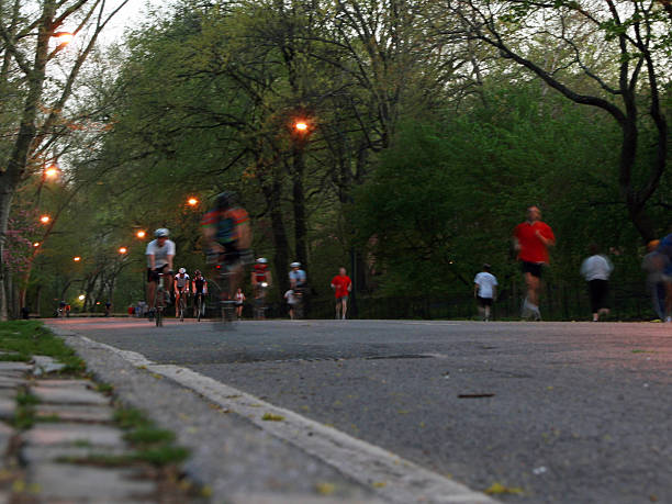 people exercising in central park.  motion blur. stock photo