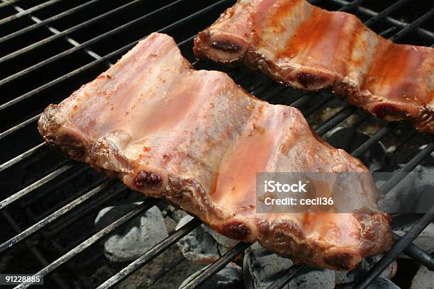 Foto de Costelas De Carne Suína e mais fotos de stock de Carne de Porco - Carne de Porco, Chama, Churrasco