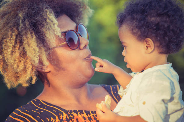 istock Mother and daughter having fun in the park 912290888