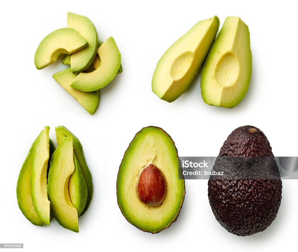 Whole and sliced avocado Whole and sliced avocado isolated on white background. Top view Avocado Stock Photo