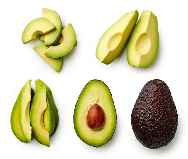 Photo of Whole and sliced avocado