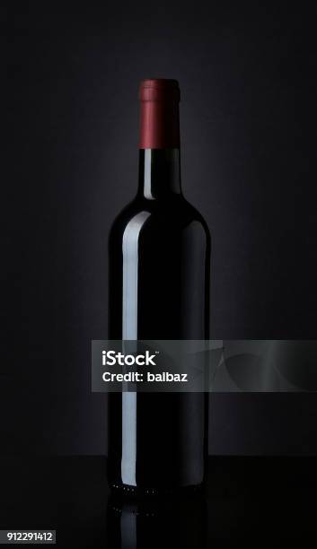 Bottle Of Red Wine On Black Background Stock Photo - Download Image Now - Template, Wine, Wine Bottle