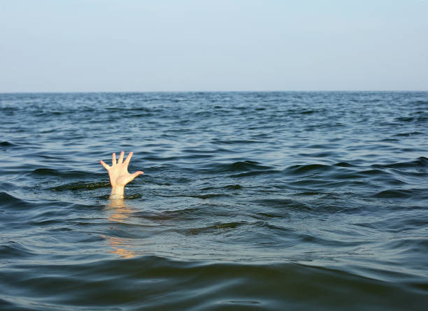 istock hand of the person seeks help while he is drowning 912291452