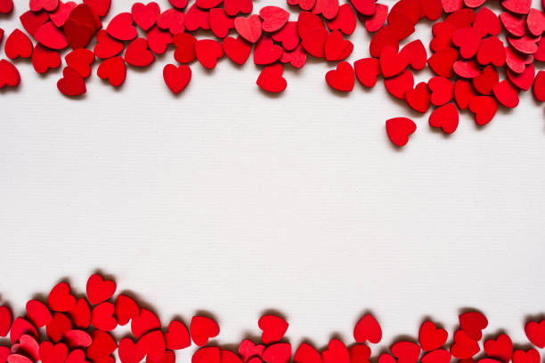 istock Valentines Day background with red hearts on white surface. Romantic seamless pattern for holiday decoration. 912291716