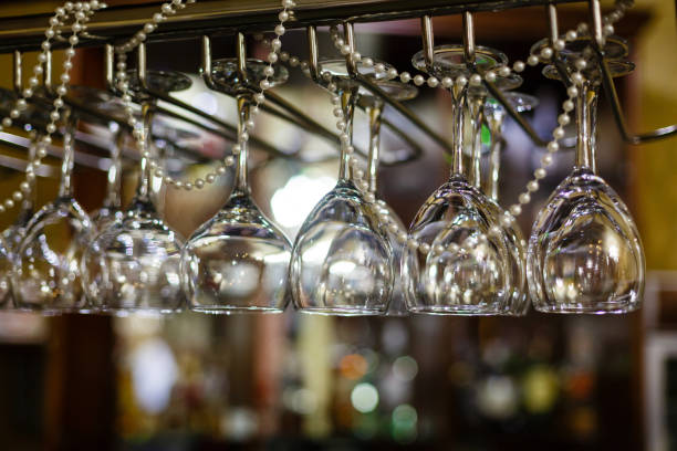 istock Empty glasses for alcohol beverage above a bar rack background 912291992