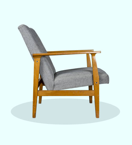istock An old armchair with gray cover 912295462