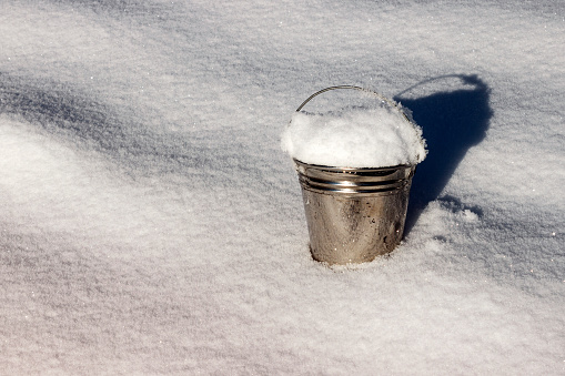 A Bucket Of Snow In The Snow Close Up Stock Photo - Download Image Now - Bucket, Cold Temperature, December - iStock