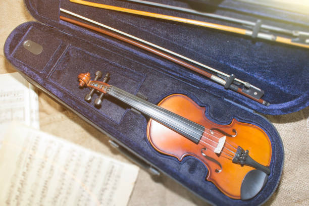 istock Violin neck on music papers background 912296404