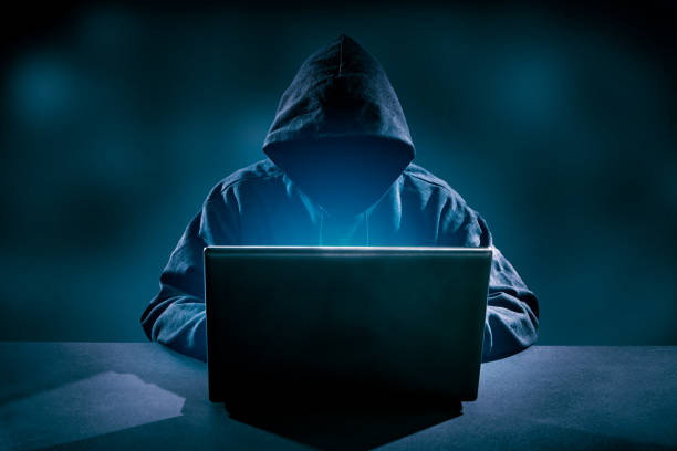 Computer crime concept. Hacker using laptop. Lots of digits on the computer screen. computer crime stock pictures, royalty-free photos & images