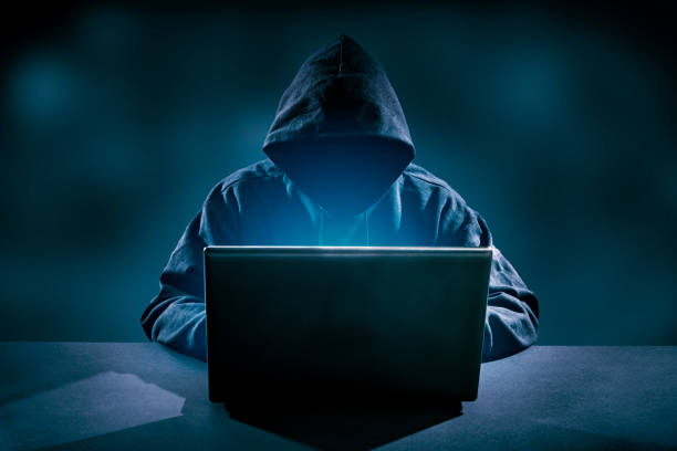 Computer crime concept. Hacker using laptop. Lots of digits on the computer screen. Computer Crime stock pictures, royalty-free photos & images