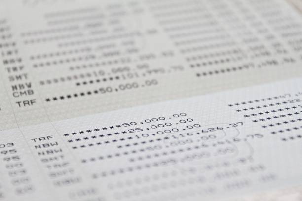 istock Savings account passbook or financial statement on table 912300370