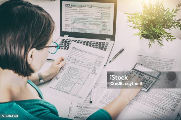 The Concept Of Tax Settlement Stock Photo - Download Image Now - Tax Form, Tax, Financial Advisor