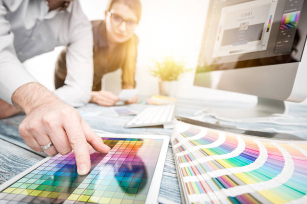 graphic designer at work. color samples. - graphic designer imagens e fotografias de stock