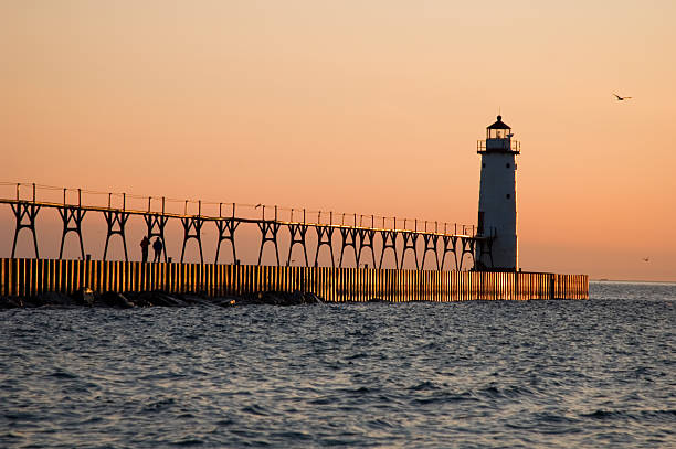 istock Lighthouse in Orange Sunset on Lake Michigan, Great Lakes 91230487