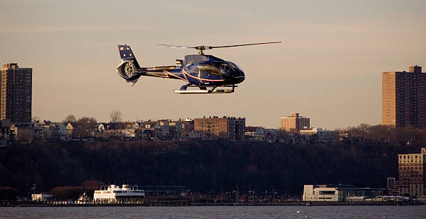 Helicopter flying over the Hudson river stock photo