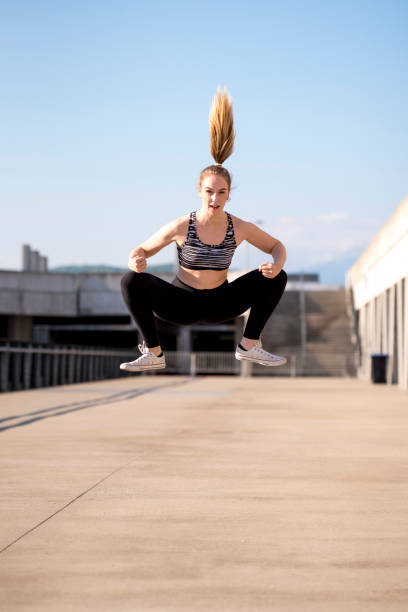 istock Girl jumping outdoors 912307052