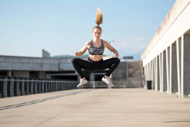 istock Girl jumping outdoors 912307094