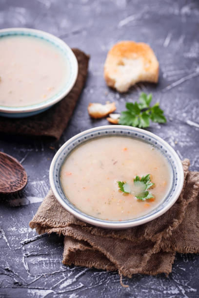 istock Healthy vegetarian peas soup on concrete background 912307504
