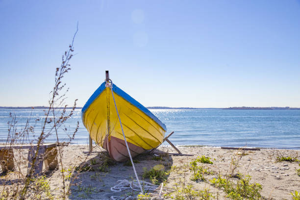 istock old wooden boat on the sandy shore 912307562