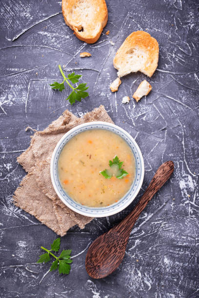 istock Healthy vegetarian peas soup on concrete background 912307606