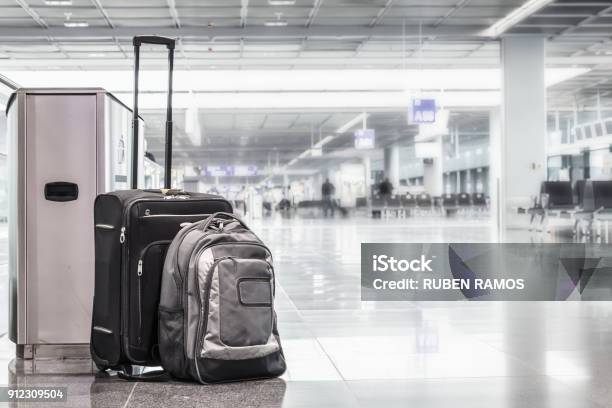 Unattended Cabin Case And Abackpack At The Boarding Gates Of An Airport Stock Photo - Download Image Now