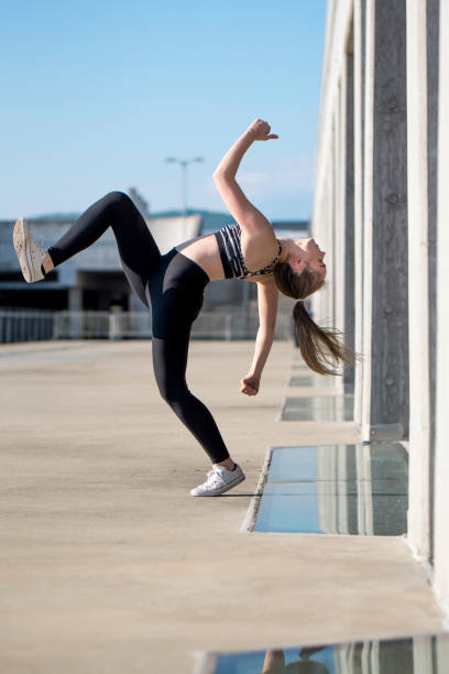 istock Female dancer posing outdoors 912310742