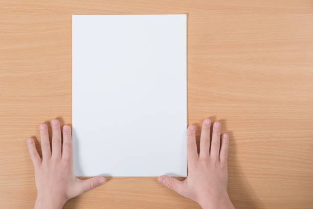 istock blank sheet of paper with place for your text lying on the table 912311390