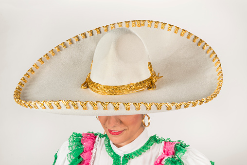 This is a special elegant hat used in dances and fiestas in Mexico. It is made using gold thread as a type of embroidery