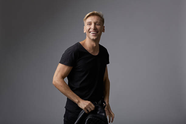 istock Portrait happy young man with shiny smile 912318420